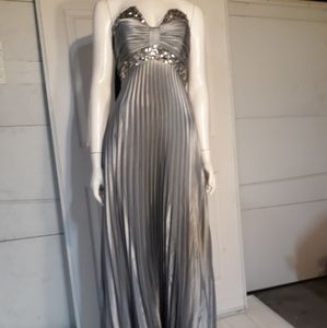 A pleated silver dress, label "cinderella"